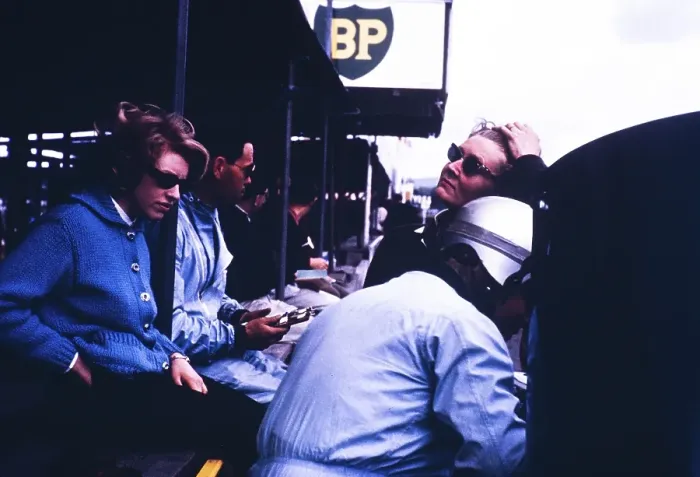Framed Print : Pat Coundley and Mary de Selincourt, John Coundley in helmet, Goodwood BARC race on 18 May 1963, John Coundley Racing Partnership