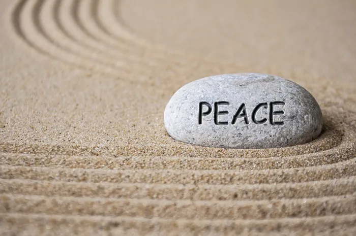 Framed Print : Peace text engraved on Zen stone on sand Framed Print : Peace text engraved on Zen stone on sand