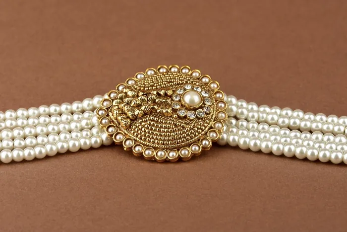 Framed Print : Pearl Jewelry on a brown background