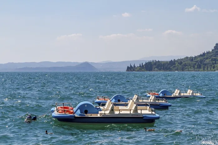 Framed Print : Three pedal boats anchored on Lake Garda Framed Print : Three pedal boats anchored on Lake Garda