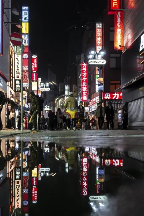 Framed Print : Pedestrian, street with illuminated advertising and advertising signs at night