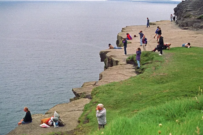 Framed Print : People on the cliff edge, there was no fence back then Framed Print : People on the cliff edge, there was no fence back then