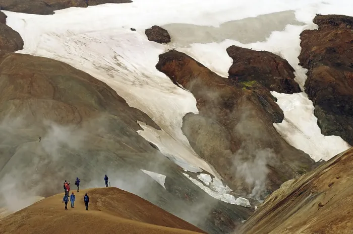 Framed Print : People on a hiking trail in front of snowfields