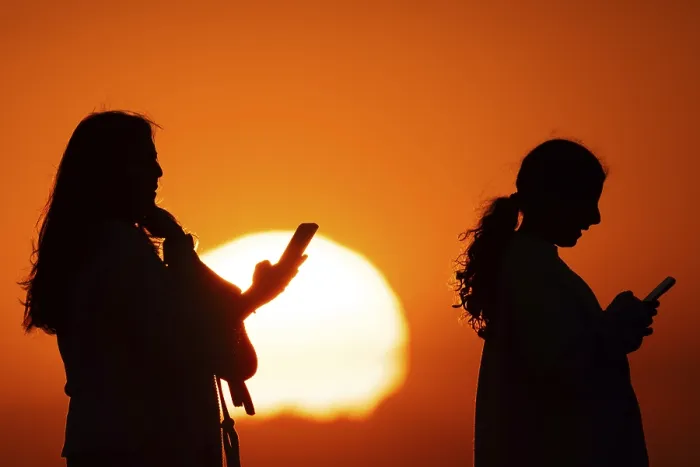 Framed Print : People photographing the sun setting on the horizon with their smartphones from the summit of the GroBer Feldberg Framed Print : People photographing the sun setting on the horizon with their smartphones from the summit of the GroBer Feldberg