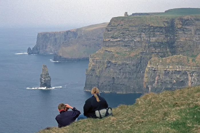 Framed Print : People take pictures at the edge of a cliff