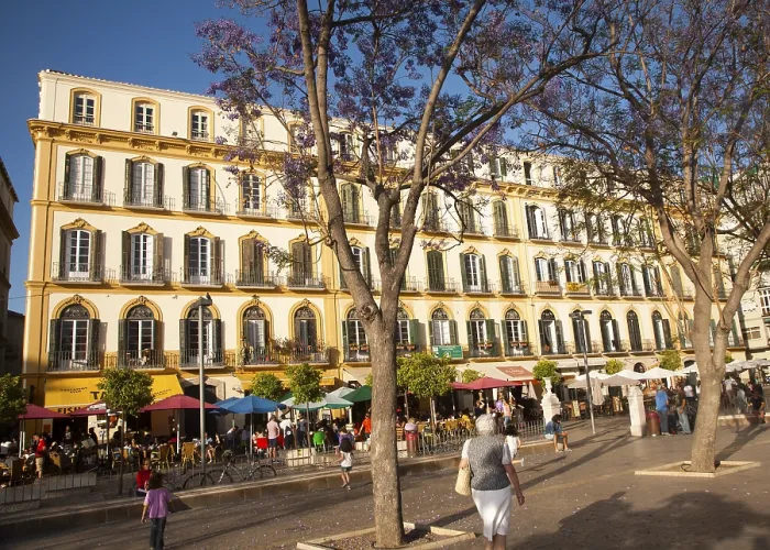Framed Print : People sitting outside popular cafes on a sunny afternoon in Plaza de la Merced