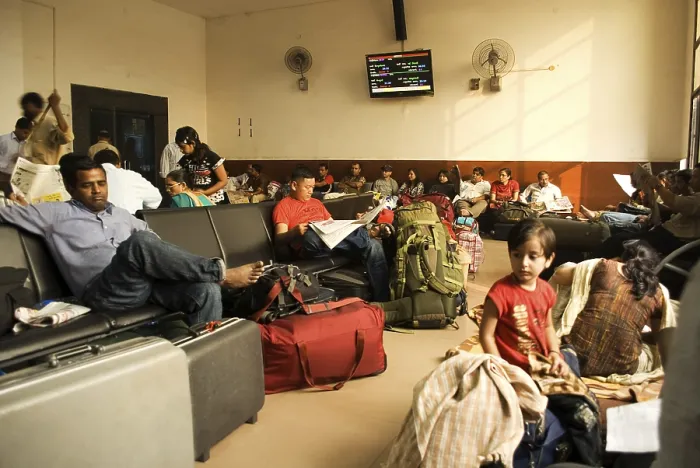 Framed Print : People sitting in waiting room of railway station Framed Print : People sitting in waiting room of railway station