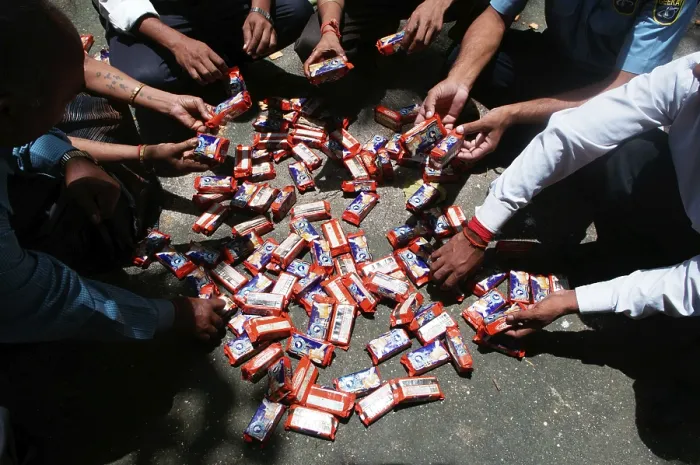 Framed Print : People sorting polluted biscuit packets due to container ship chitra colliding in sea Bombay Mumbai Framed Print : People sorting polluted biscuit packets due to container ship chitra colliding in sea Bombay Mumbai