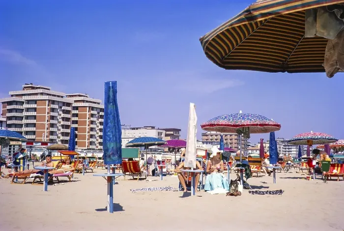 Framed Print : People sunbathing on the sandy beach of Rimini, Emilia Romagna region, Italy 1969
