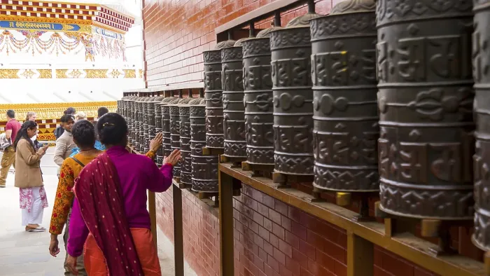 Framed Print : People turn the prayer wheels in a Buddhist temple and create a spiritual atmosphere