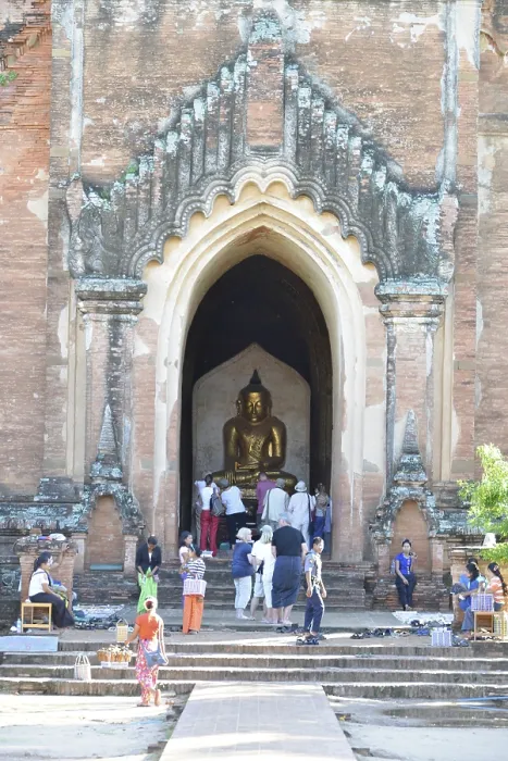 Framed Print : People visit a large temple with an imposing entrance and Buddha statue