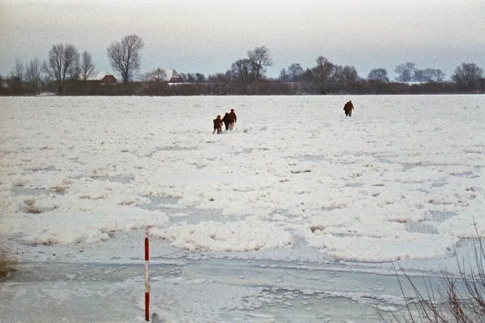 Framed Print : People walk across ice rink, frozen Elbe Framed Print : People walk across ice rink, frozen Elbe