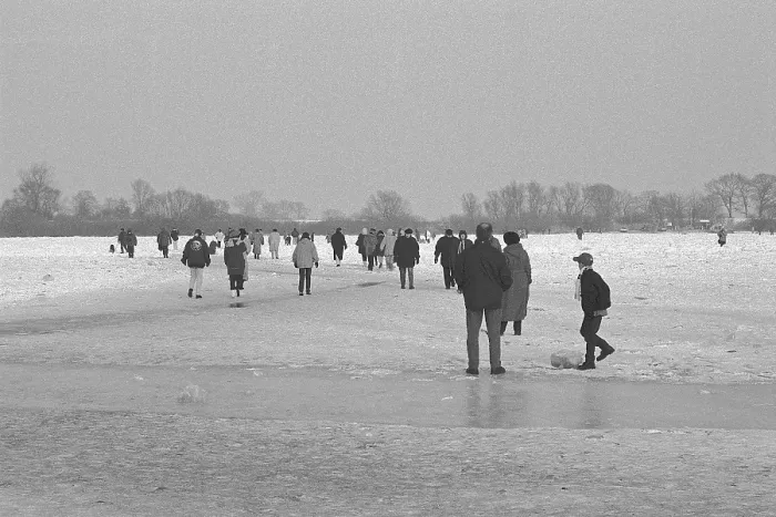 Framed Print : People walk across ice rink, frozen Elbe