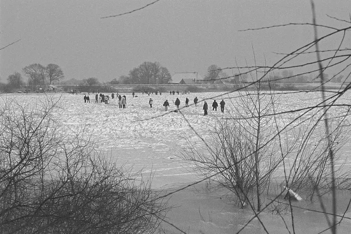 Framed Print : People walk across ice rink, frozen Elbe