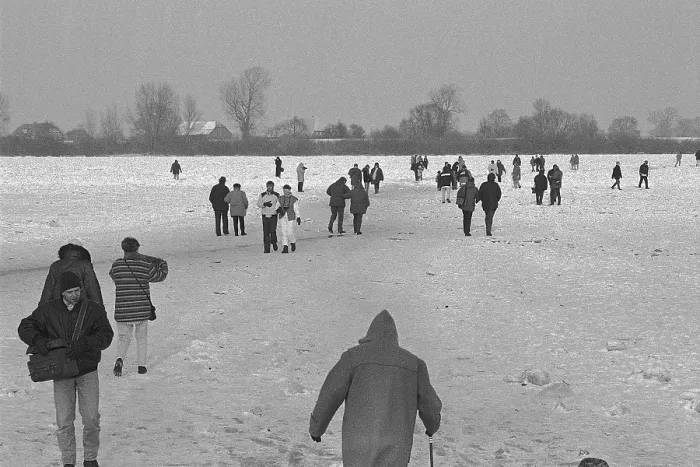 Framed Print : People walk across ice rink, frozen Elbe