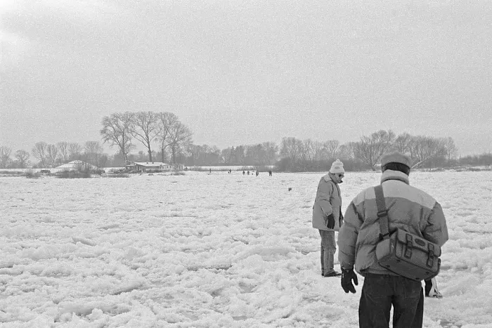 Framed Print : People walk across ice rink, frozen Elbe