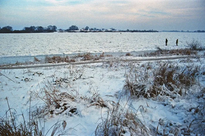 Framed Print : People walk across ice rink, frozen Elbe