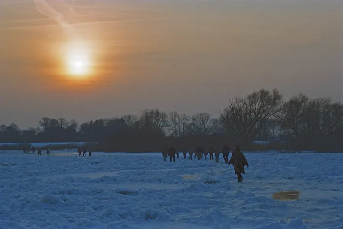 Framed Print : People walk across ice rink, sunset Framed Print : People walk across ice rink, sunset