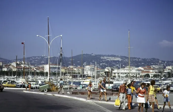 Framed Print : People walking past a harbour crowded with boats in Cannes, Cote d'Azur, France 1974