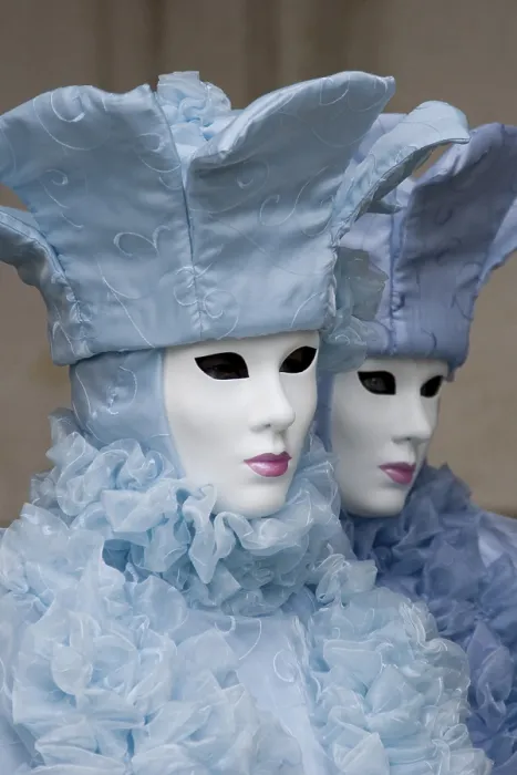 Framed Print : Two people wearing ice-blue costumes and masks