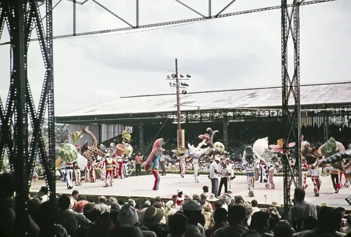 Framed Print : Performers in colourful costumes on stage as part of carnival celebrations, Port of Spain, Trinidad 1962 - captioned as Nature's Notebook Framed Print : Performers in colourful costumes on stage as part of carnival celebrations, Port of Spain, Trinidad 1962 - captioned as Nature's Notebook