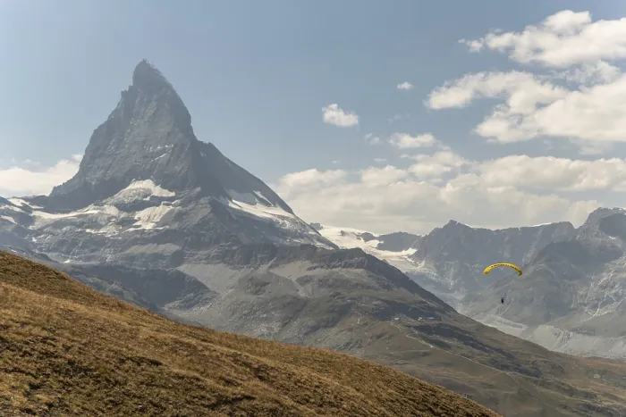 Framed Print : A person paraglides against the stunning backdrop of the Matterhorn mountain in Switzerland