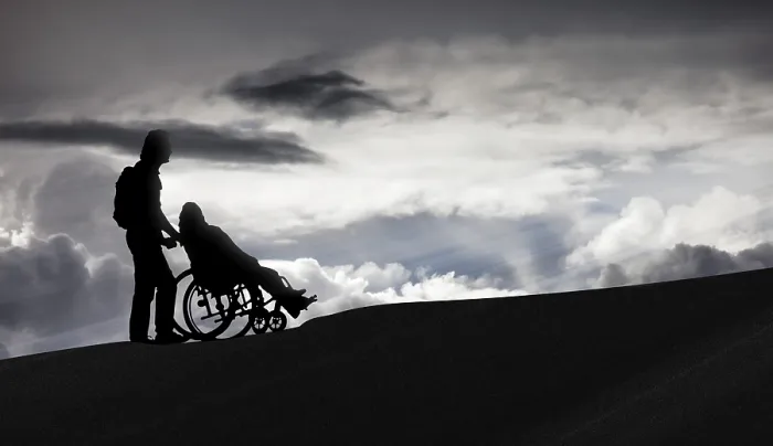 Framed Print : Person pushing a wheelchair, care for the elderly Framed Print : Person pushing a wheelchair, care for the elderly