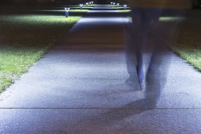 Framed Print : Person Walking on a Illuminated Walkway at Night in Long Exposure in Switzerland