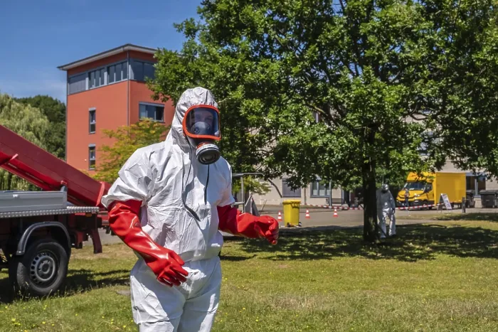 Framed Print : Pest controller in protective suit during oak processionary moth operation Framed Print : Pest controller in protective suit during oak processionary moth operation