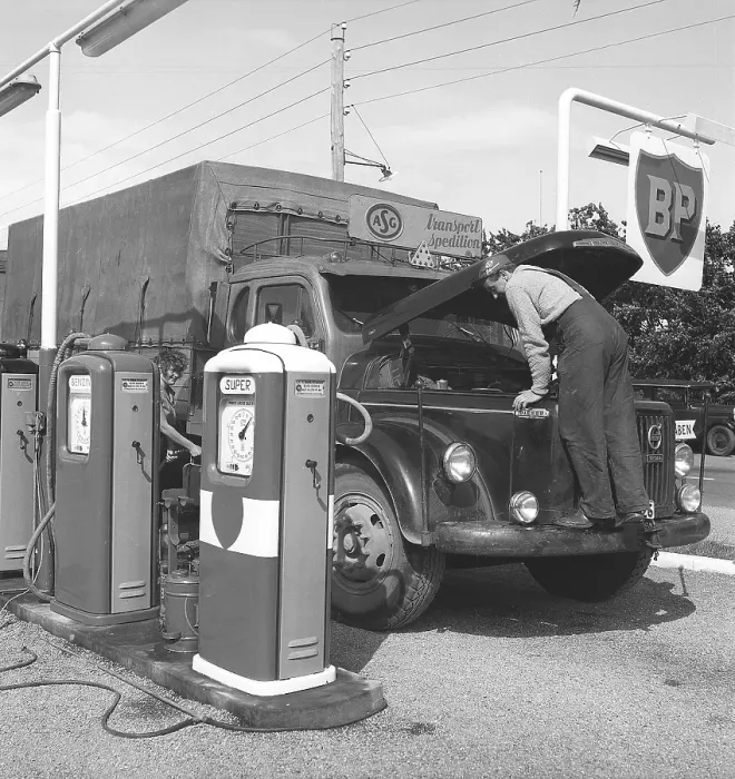 Framed Print : Petrol station in the olden days. Here, a truck driver from the company ASG has stopped and opened the hood of his Volvo truck. The petrol station belongs to the English petroleum company BP (British Petroleum) Framed Print : Petrol station in the olden days. Here, a truck driver from the company ASG has stopped and opened the hood of his Volvo truck. The petrol station belongs to the English petroleum company BP (British Petroleum)