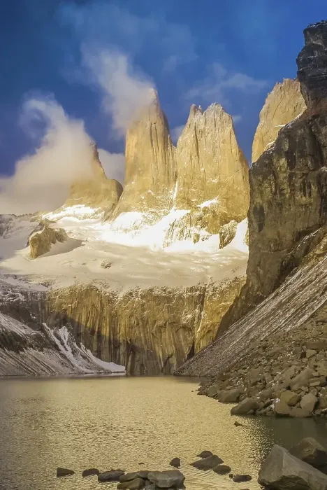 Framed Print : Photo of river and rocks covered in snow in Parque Nacional Torres del Paine in Chile