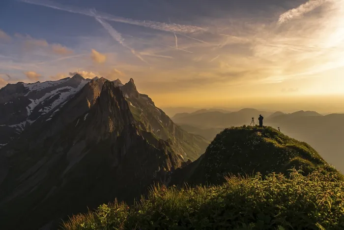Framed Print : Photographer on grassy ridge at sunset with Santis peak in the background