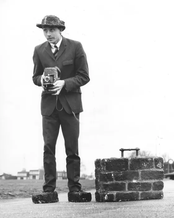Framed Print : Photographer, man with suitcase