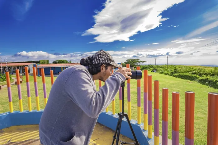Framed Print : Photographer photographing a beautiful landscape Framed Print : Photographer photographing a beautiful landscape