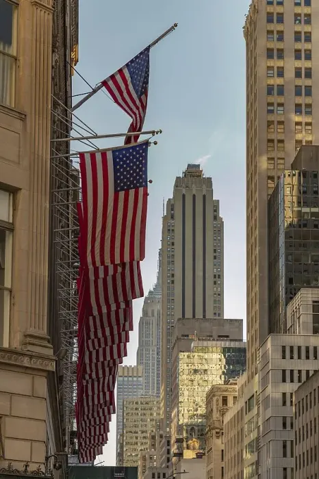 Framed Print : A picture of a row of American flags in the streets of New York