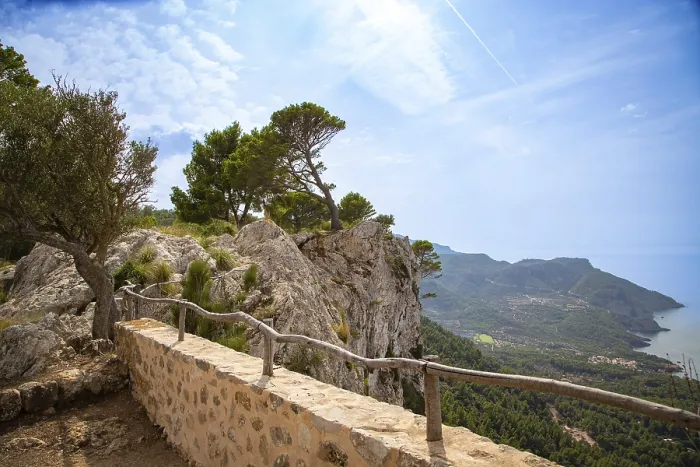 Framed Print : A picturesque cliff landscape with trees and a view of the sea and the coast under a blue sky