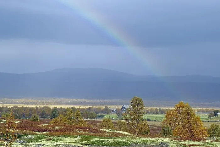 Framed Print : Picturesque landscape with rainbow over autumn coloured trees and mountains in the background Framed Print : Picturesque landscape with rainbow over autumn coloured trees and mountains in the background