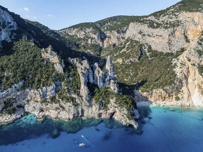 Framed Print : Picturesque rocky coast, cliffs with L'Aguglia pinnacle