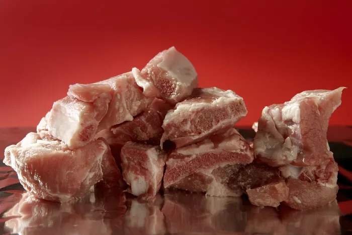 Framed Print : Pig, pork raw meat pieces over red background