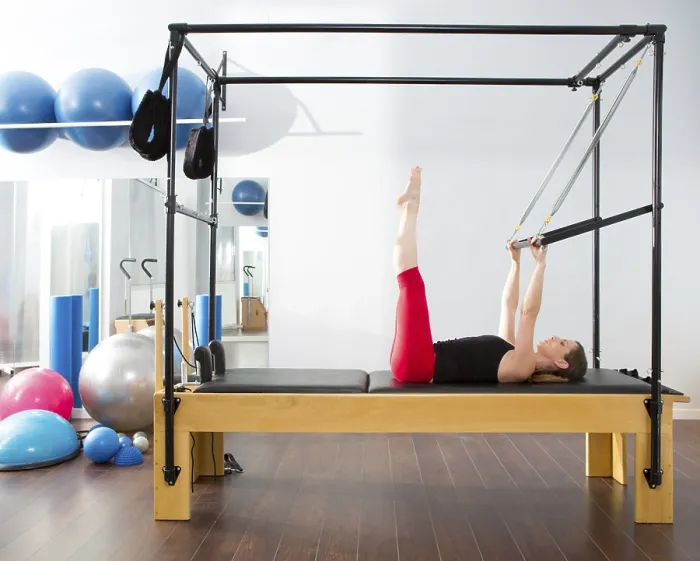 Framed Print : Pilates aerobic instructor woman in cadillac fitness exercise Framed Print : Pilates aerobic instructor woman in cadillac fitness exercise