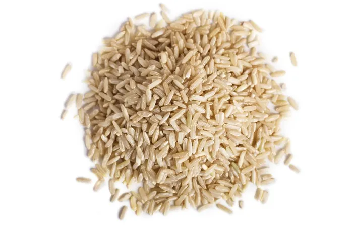 Framed Print : Pile of brown rice isolated on white background