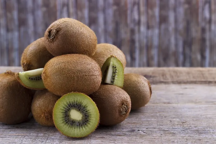 Framed Print : Pile of fresh kiwi on an old wooden board Framed Print : Pile of fresh kiwi on an old wooden board