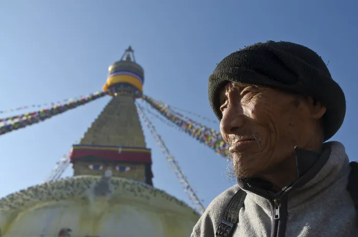 Framed Print : Pilgrim in front of Boudnath Stupa Framed Print : Pilgrim in front of Boudnath Stupa