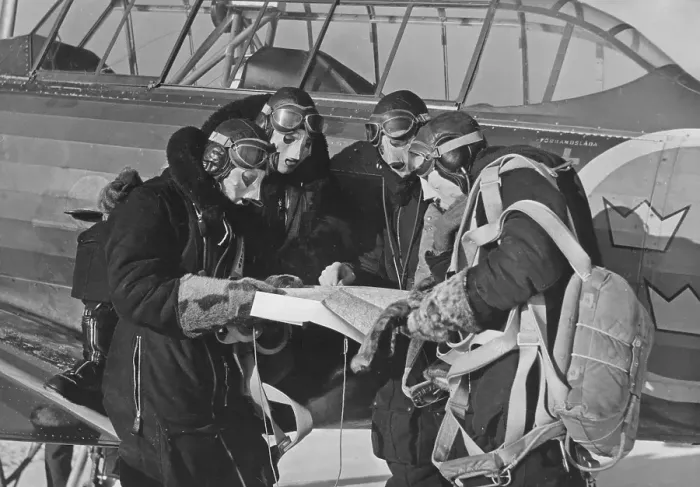 Framed Print : Pilots in the 1940s. A group of swedish pilots are studying the map together prior their flying assignment Framed Print : Pilots in the 1940s. A group of swedish pilots are studying the map together prior their flying assignment