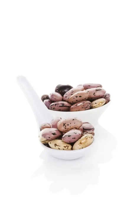 Framed Print : Pinto beans on white spoon isolated on white background Framed Print : Pinto beans on white spoon isolated on white background