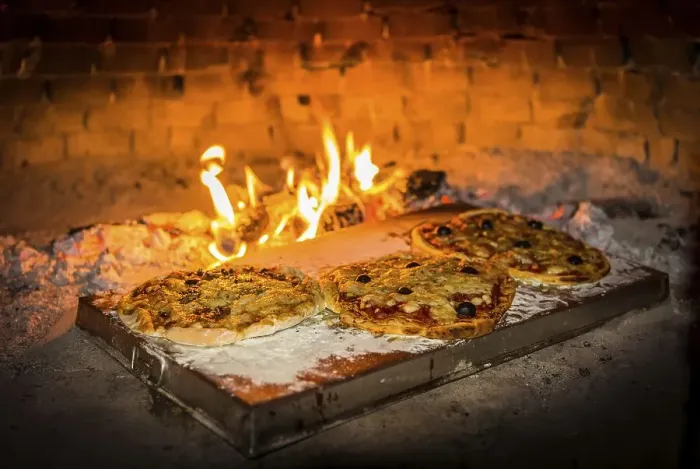 Framed Print : Pizza is baked in a pizza oven Framed Print : Pizza is baked in a pizza oven