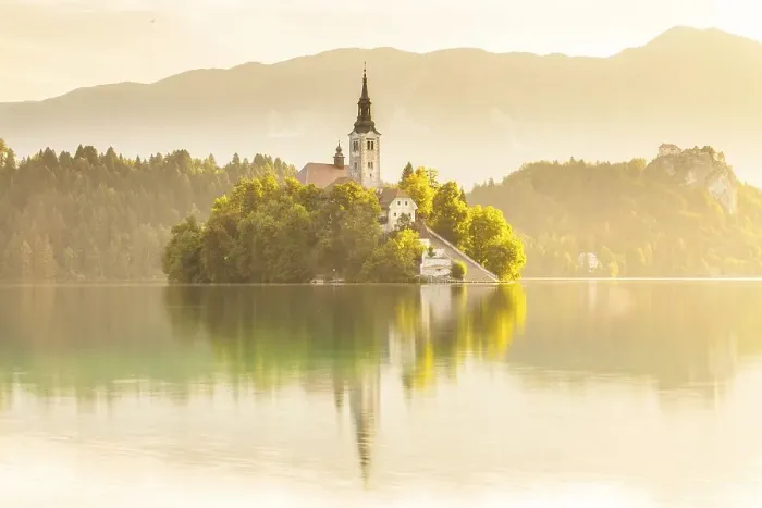 Framed Print : Placid scene of the island of Bled with its church surrounded by the Julian Alps