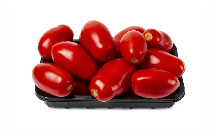 Framed Print : Plum-shaped tomatoes, fresh, in a black plastic container