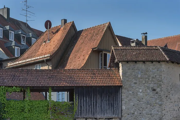 Framed Print : Pointed gable houses with tiled roofs and town wall with battlements Framed Print : Pointed gable houses with tiled roofs and town wall with battlements