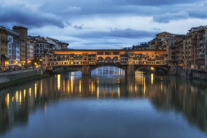 Framed Print : Ponte Vecchio and the buildings close by at night reflecting on the river Arno